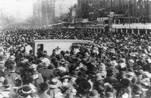 Crowd of spectators blocking the ambulance at 1912 women's march